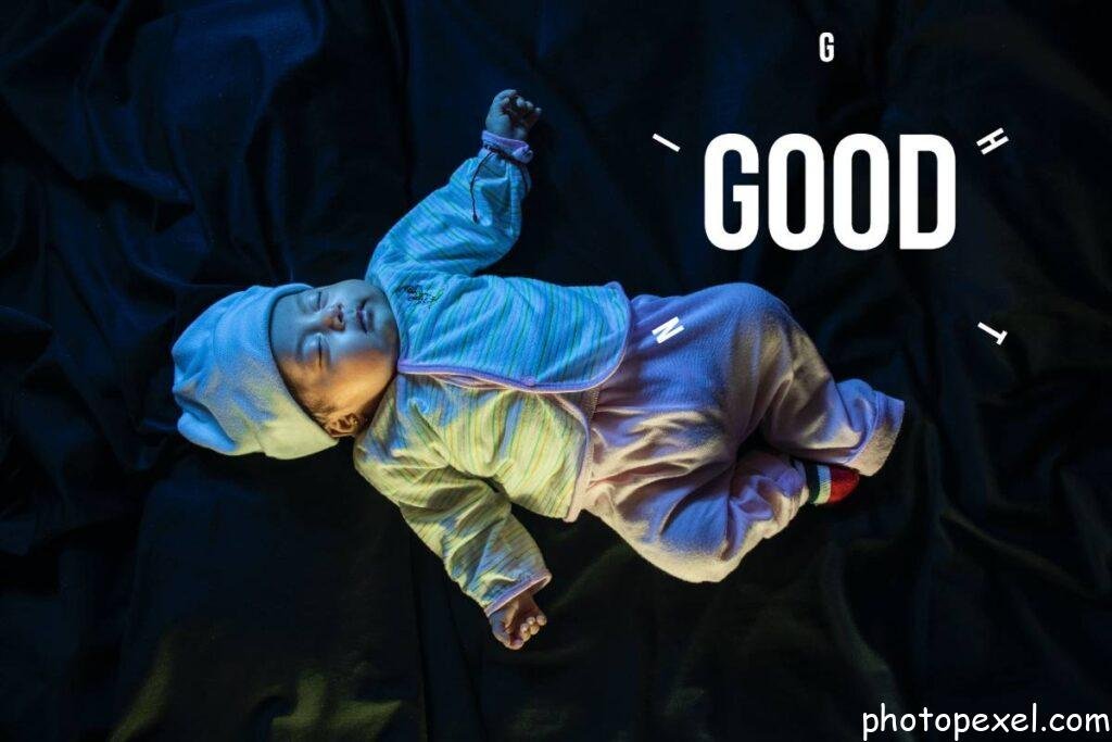 A-Cute-Kid-Lying-On-Black-Textile-Good-Night-Images