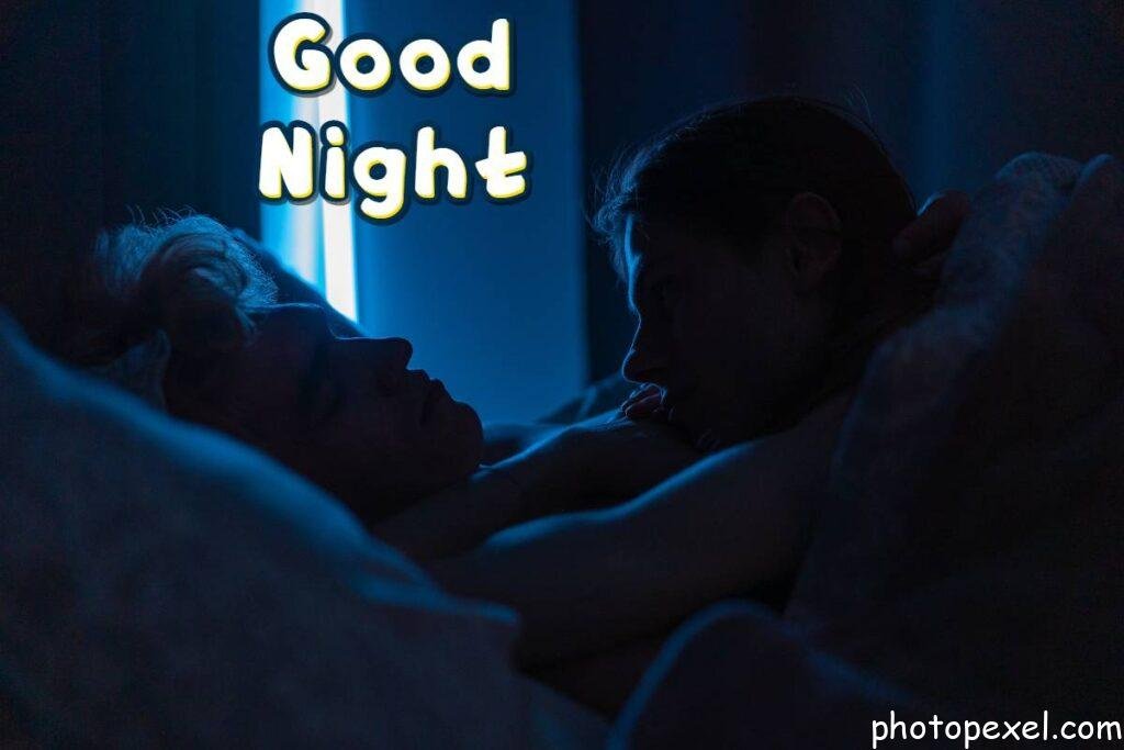 A-Man-Looking-At-His-Partner-While-Sleeping-Good-Night-Images