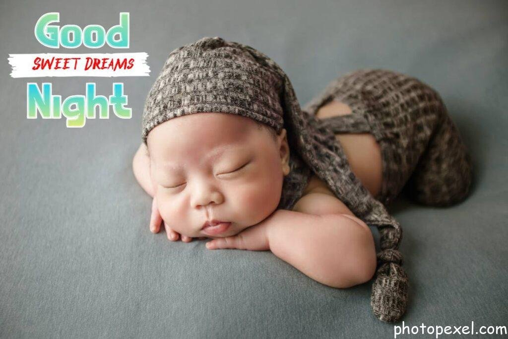 A-Newborn-Baby-With-Hands-On-Chin-While-Sleeping-Good-Night-Images