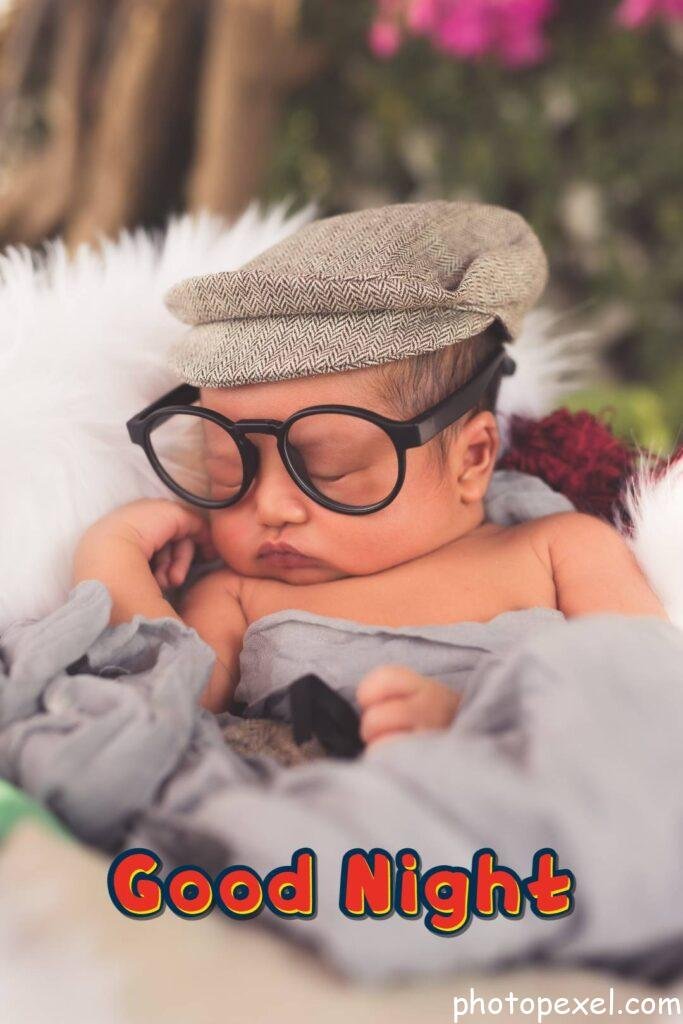 A-Newborn-Wearing-A-Hat-And-Eyeglasses-Good-Night-Images