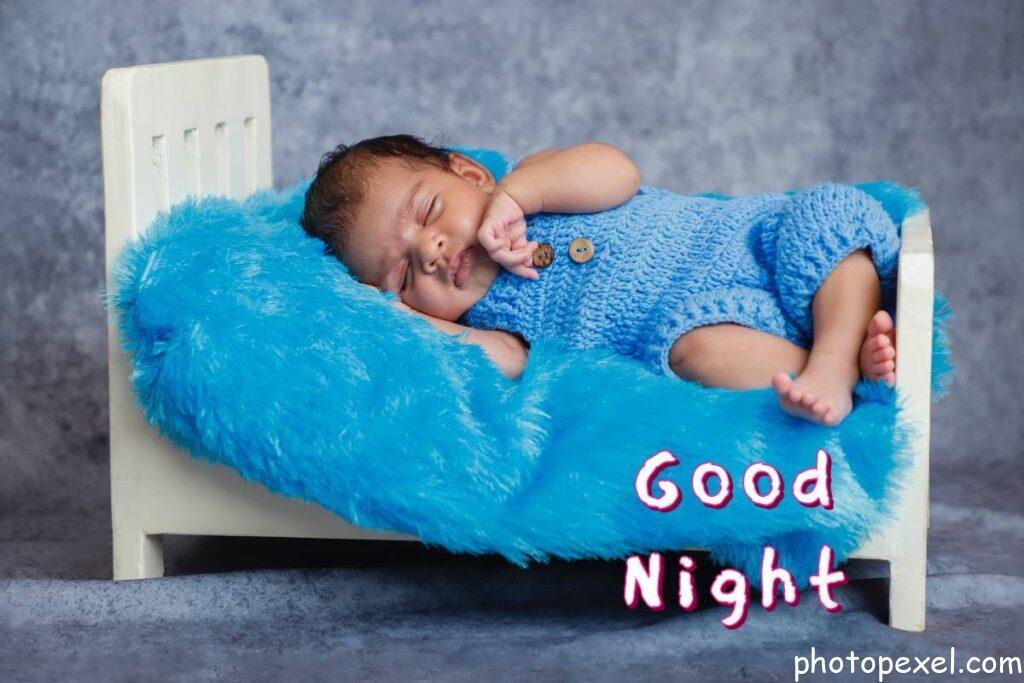 Adorable-Infant-In-Blue-Overalls-Crochet-Clothes-Sleeping-On-Small-Bed-Good-Night-Images