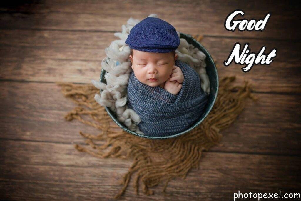 Baby-Wearing-A-Flat-Cap-Sleeping-Inside-A-Bucket-Good-Night-Images