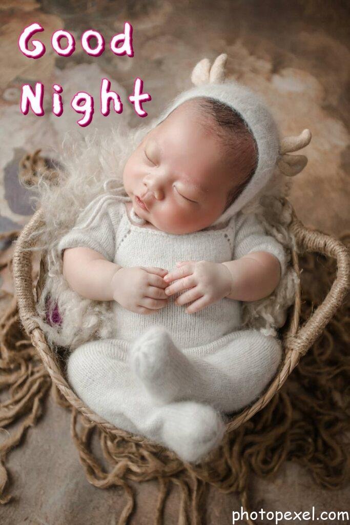 Newborn-Wearing-White-Knitwear-Good-Night-Images