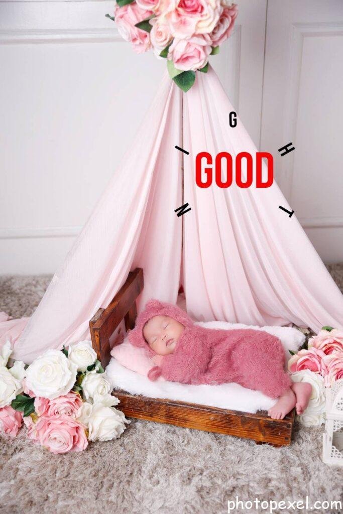 Sleeping-Baby-In-Pink-Romper-Lying-On-White-Bed-Good-Night-Images