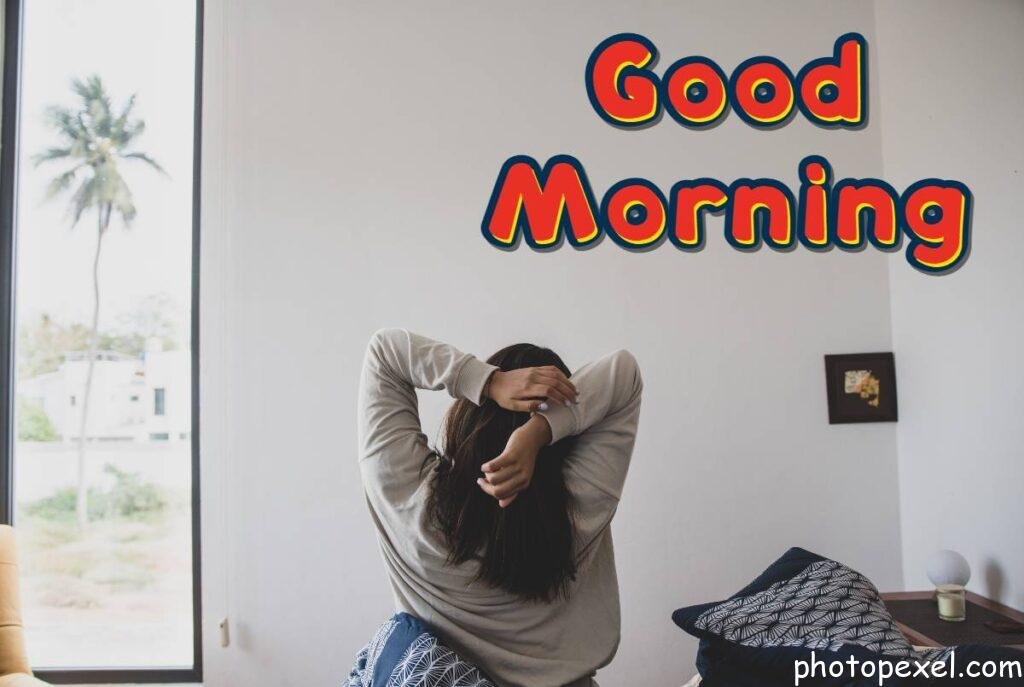 Woman-In-Gray-Sweater-Stretching-Her-Arms-In-The-Morning-Good-Morning-Images