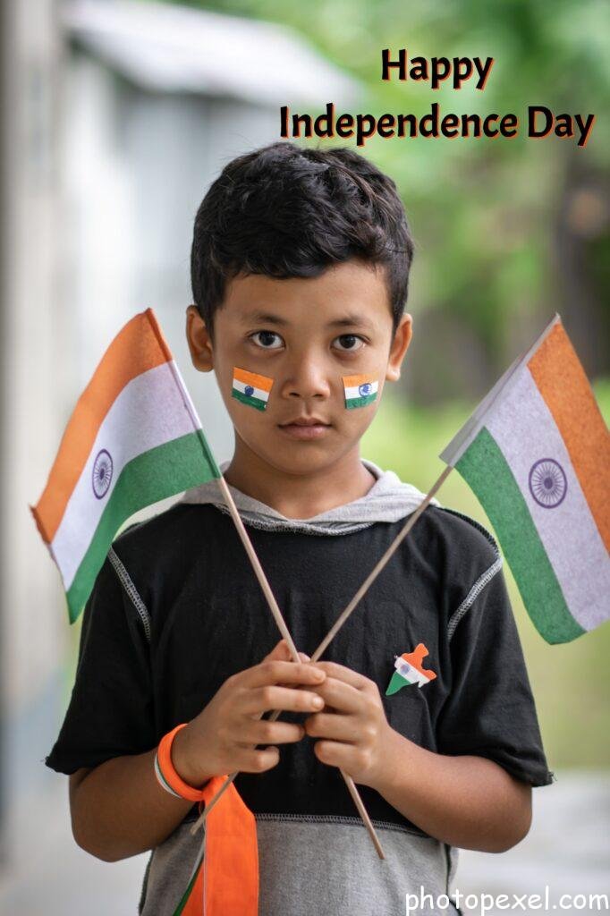 A-Boy-Holding-Two-Indian-Flags-Happy-Independence-Day-Images