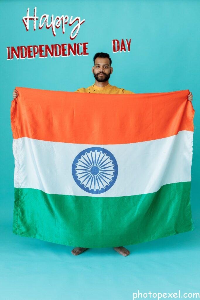 A-Guy-Holding-The-Flag-Of-India-Happy-Independence-Day-Images